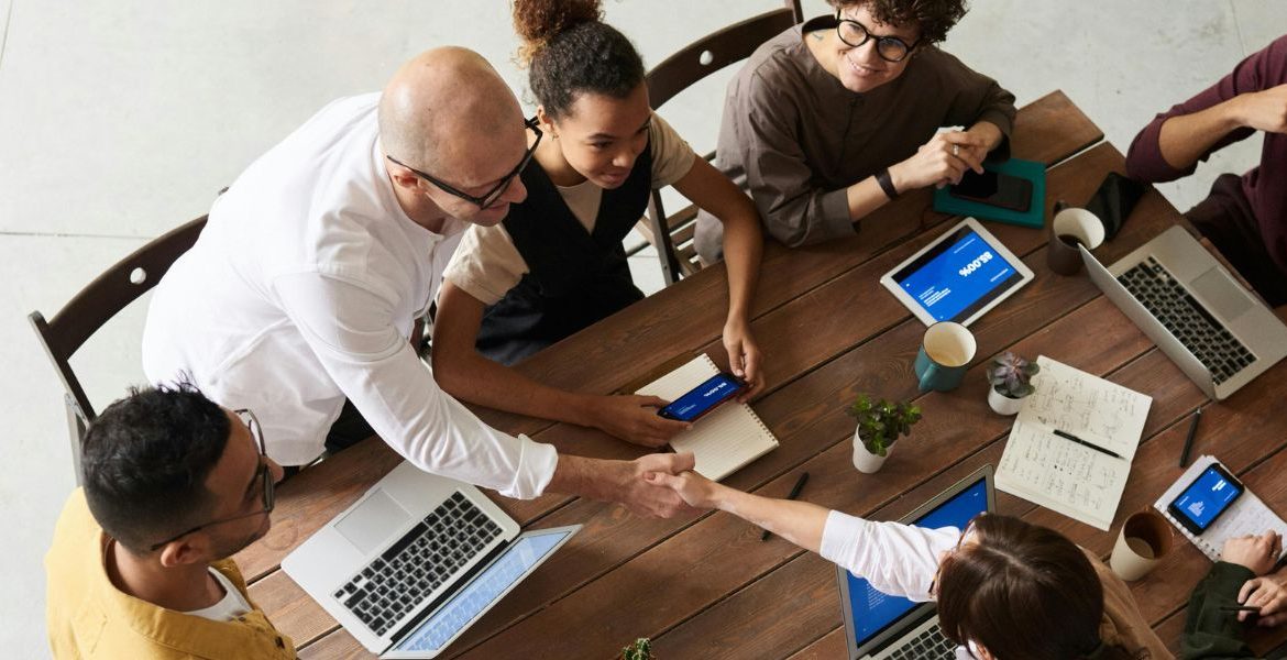 Team collaborating in a modern office environment, leveraging fiber-optic internet for seamless connectivity and productivity.