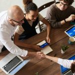 Team collaborating in a modern office environment, leveraging fiber-optic internet for seamless connectivity and productivity.