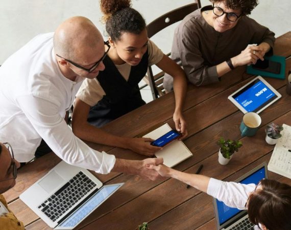 Team collaborating in a modern office environment, leveraging fiber-optic internet for seamless connectivity and productivity.