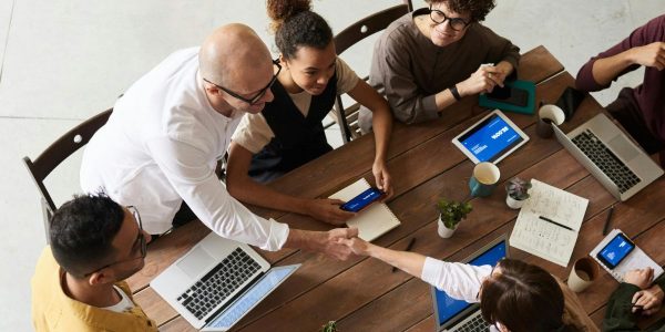 Team collaborating in a modern office environment, leveraging fiber-optic internet for seamless connectivity and productivity.